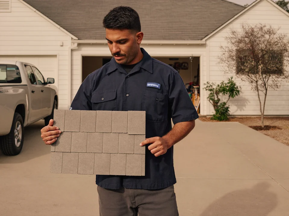 Illustrative scene of a roofer working on a roof